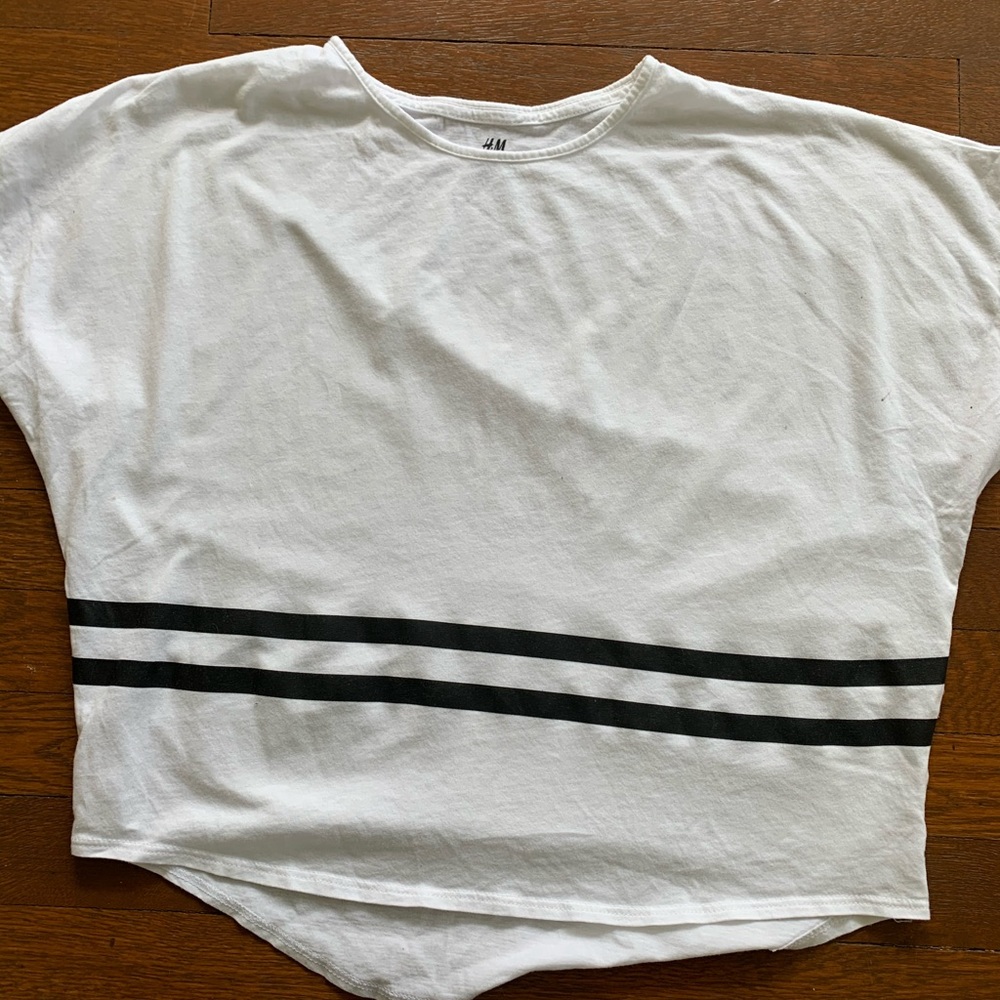 White t-shirt with black stripes.